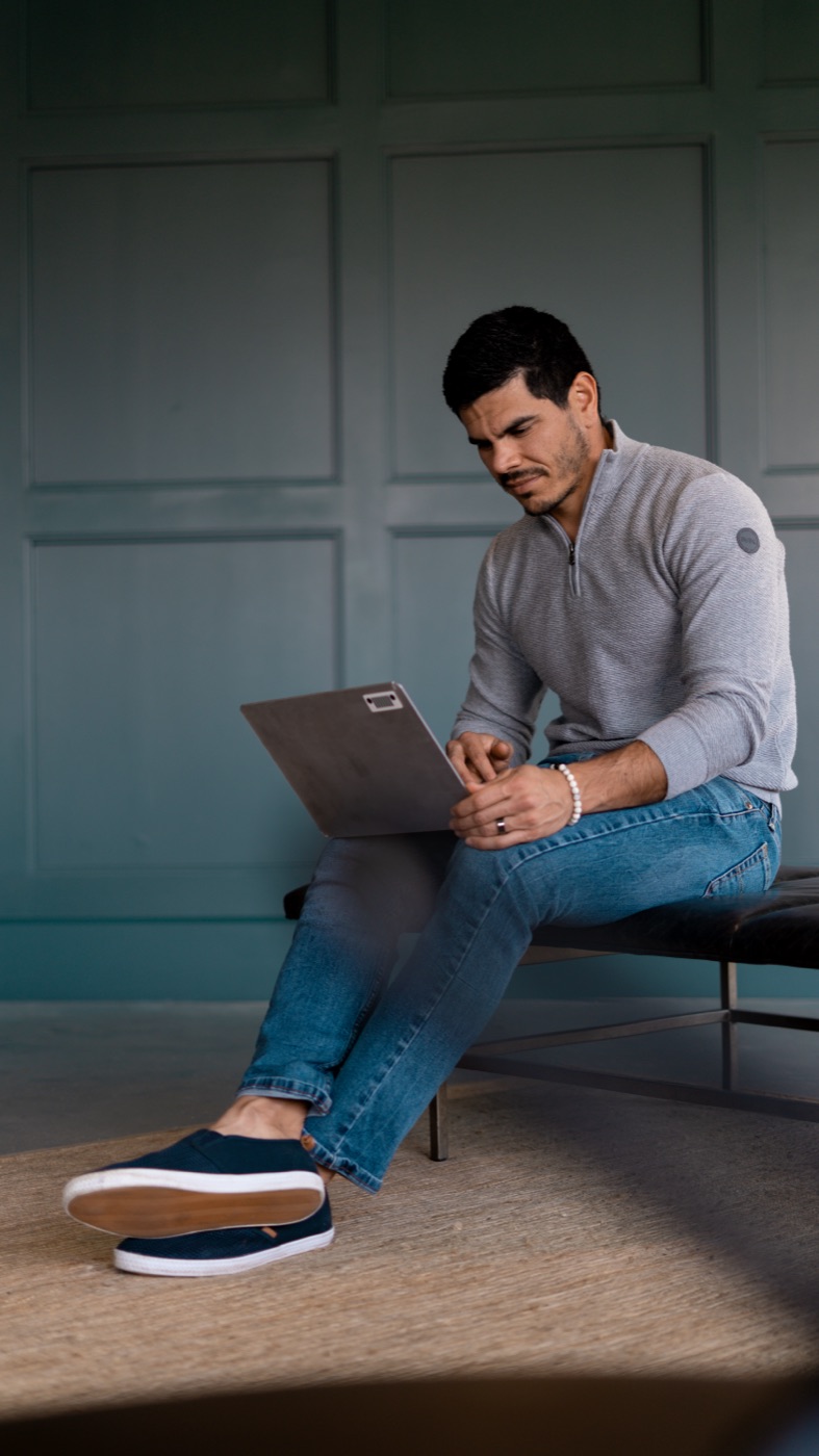 Andres Ayesta reviewing a client plan on his laptop